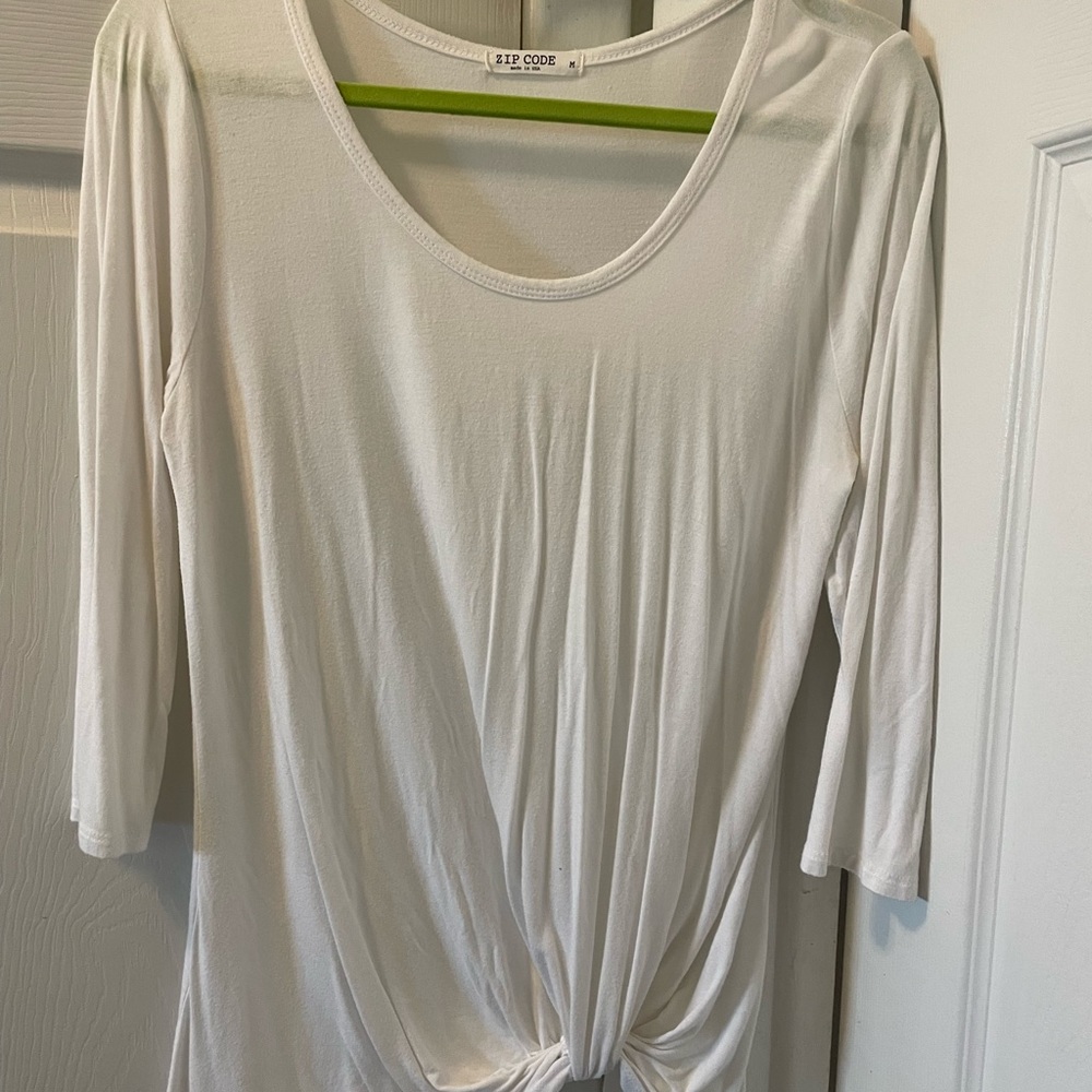 White 3/4 sleeve Zip Code ladies top.